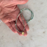 Gold Om Charm Turquoise Necklace